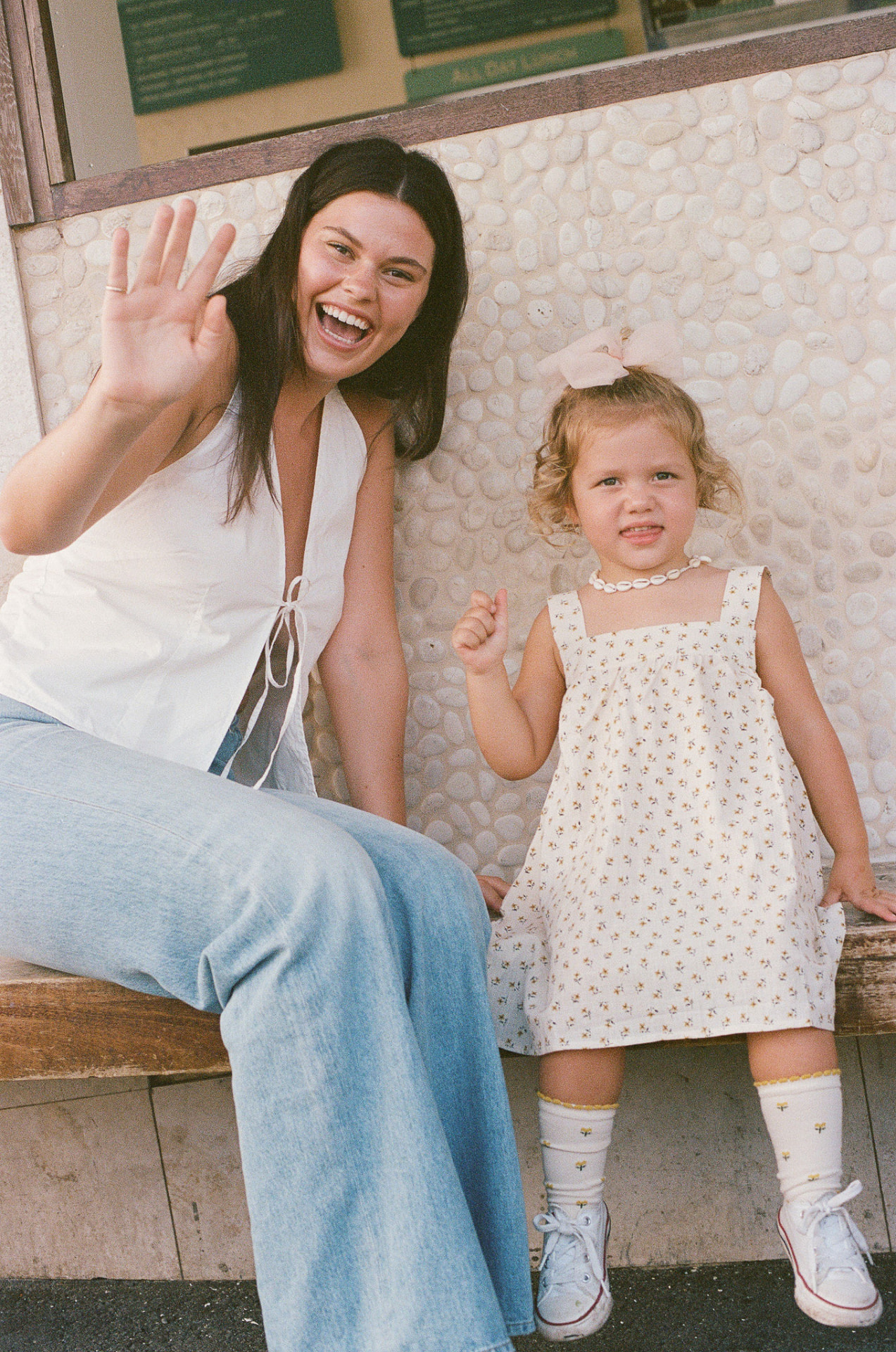 A local mum and her mini waving hello